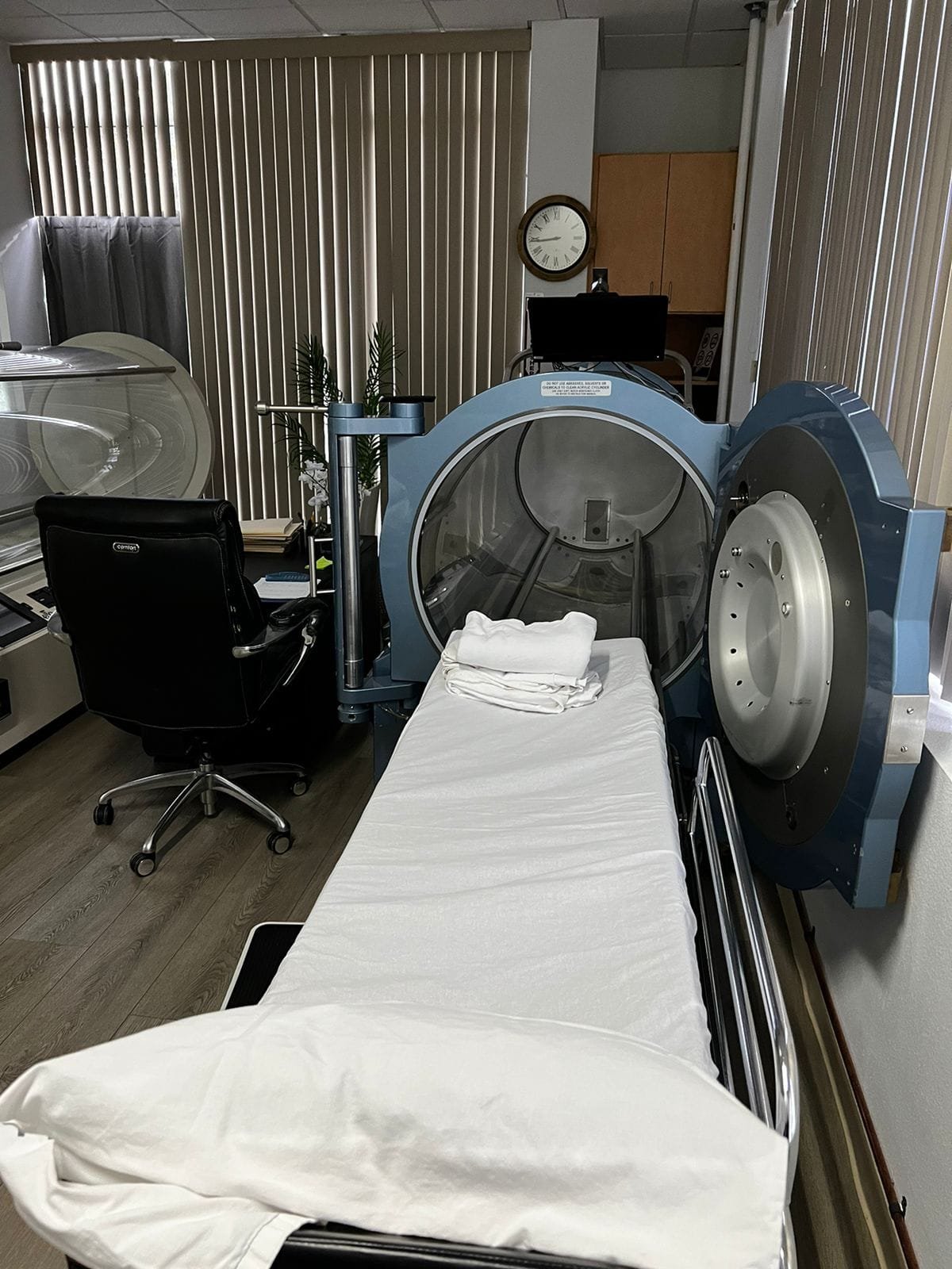 Medical-grade hyperbaric chamber with patient bed at Pacific Hyperbarics — Madras